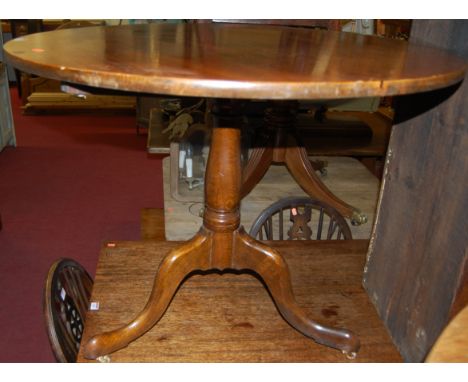 An oak circular pedestal tripod table, dia.91cm 