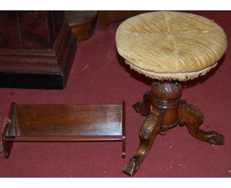 An Art Nouveau walnut table top book trough, together with a Victorian walnut piano stool (2)