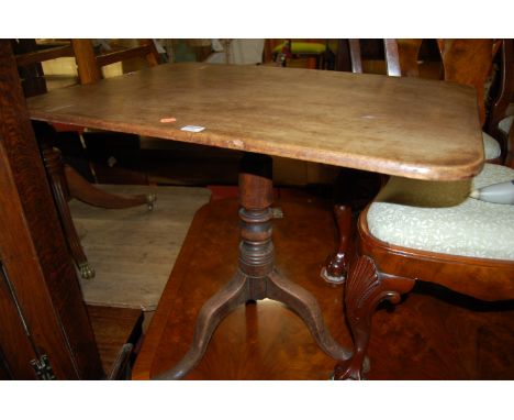 An early 19th century mahogany round cornered, tilt-top pedestal tripod table 