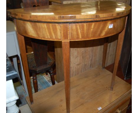 A 19th century mahogany and satinwood strung demi lune fold over card table having a green baize lined interior