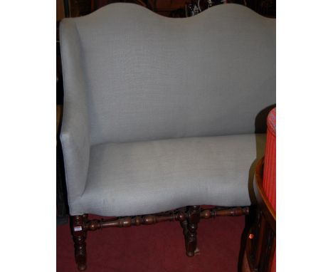 A circa 1900 walnut framed and blue upholstered triple humpback sofa, raised on ring turned and square cut supports, w.168cm