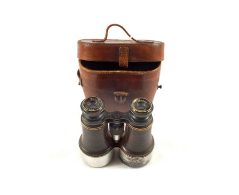 A pair of Dolland London leather bound private issue officer binoculars x 5, 2 7/16 magnification in marked Dollond & Co leat