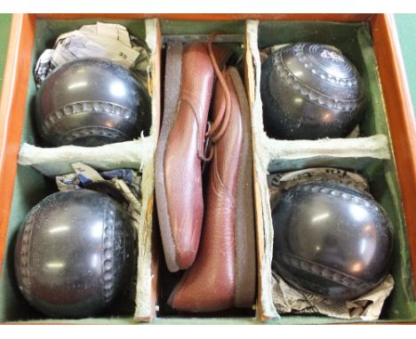 Five cased sets of lawn bowls and Jacques ceramic jack