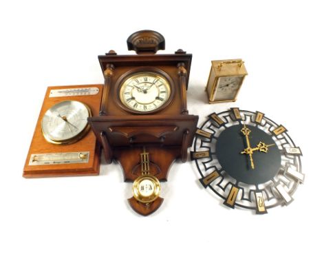 An aneroid barometer, a modern German hooded wall clock, H.Samuel carriage clock and a clock's face