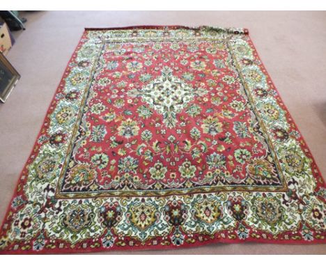 A red ground Persian style carpet, 107" x 89"