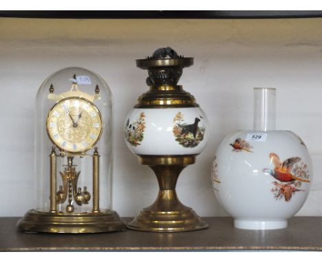 A china bowl oil lamp and Kundo dome clock
