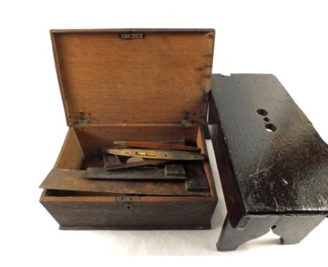An Oak box containing woodworking tools, postal scales and a stool
