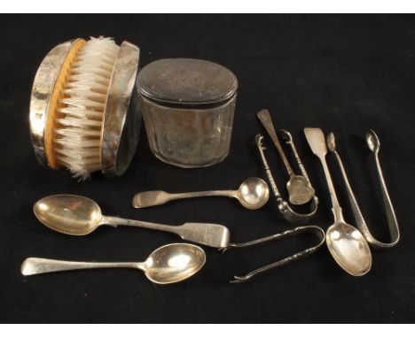 A leather box containing Silver backed brushes, toilet jar and Silver cutlery