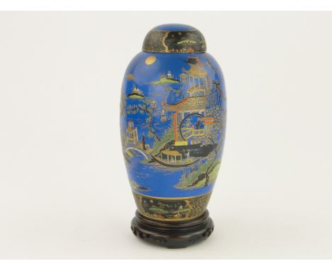 Early Carltonware jar and cover,
with painted and gilded chinoiserie design, 9" on a fitted carved wood stand.