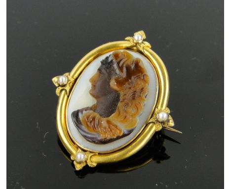 A 19th century double-sided carved hardstone swivel Cameo brooch,
1 side depicting portrait of a lady, the other depicting a 