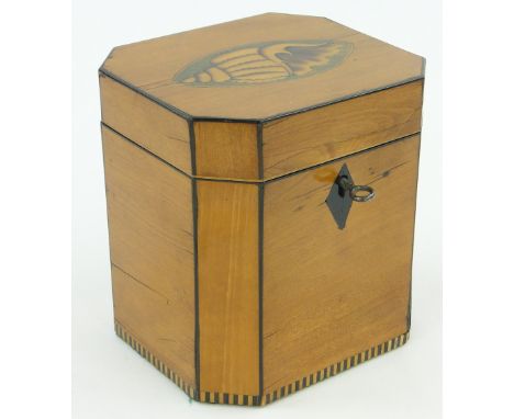 A 19th century mahogany tea caddy,
with shell design inlay to the lid, height 5".