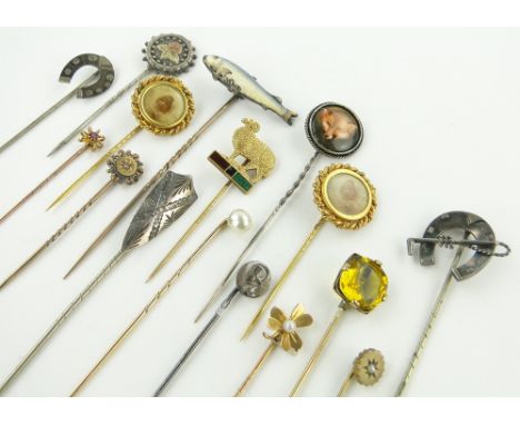 A Collection of stickpins,
including an enamel salmon design pin, (16).