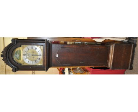 An 18th century 8-day bell striking oak long case clock,
having a 12" arched top brass dial with automaton see-saw aperture a