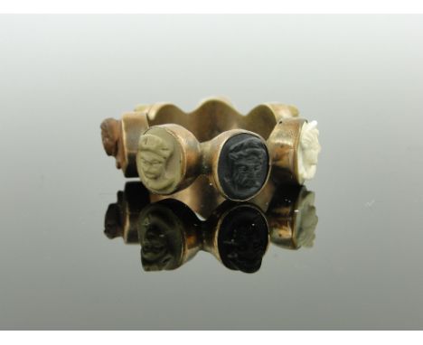An unusual Victorian multi-colour coral/lava Cameo scarf ring,
panel height 9mm.