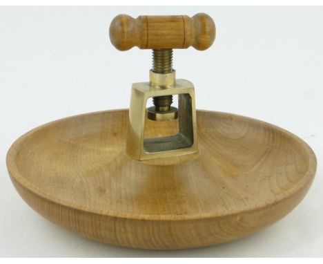 An Arts & Crafts nut bowl by Allan Guy,
with brass nutcracker, diameter 11"