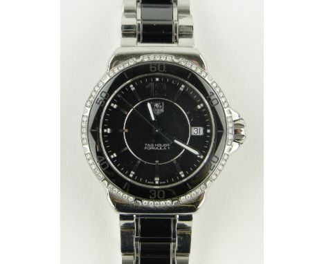 A gent's Tag Heuer Formula 1 wristwatch,
stainless steel/ceramic case and strap with calendar, 2012 with diamond set bezel, b