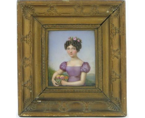 A 19th century continental painted porcelain plaque,
portrait of a young lady, framed, height 6.75" overall.
