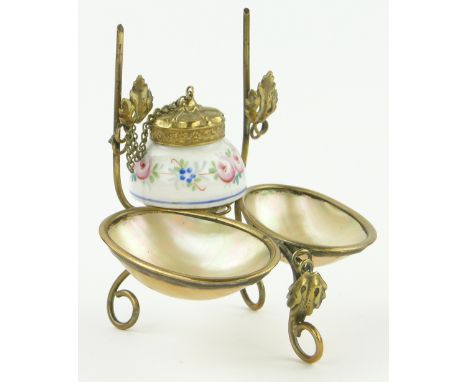 A gilt metal and mother of pearl desk stand,
with ceramic inkwell, height 4".