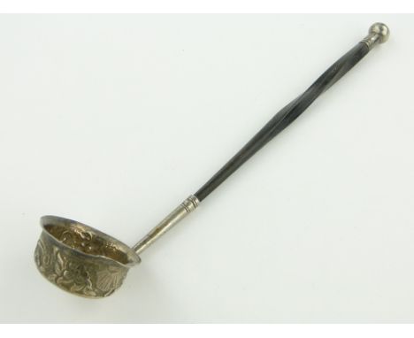 A George III Irish silver toddy ladle of small size,
with whale bone handle, makers marks P G, Dublin 1813, length 21cm.