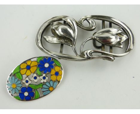 Art Nouveau silver floral design buckle,
Swedish assay marks, length 8cm together with a floral design silver and enamel broo
