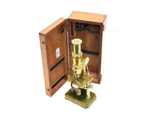 Brass Twin Pillar Travelling Microscope with plano-concave mirror, condenser lens, wheel focusing, on tilting stand with soli