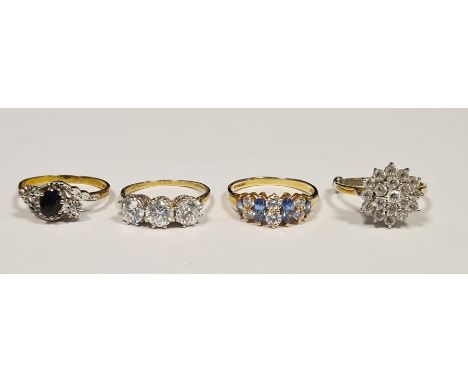 9ct gold, blue and white stone dress ring set oval stone, possibly sapphire, flanked by two very small white stones, probably