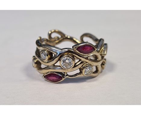 18ct white gold ruby and diamond band ring, maker’s mark GAC, London, of sinuous pierced design, set with three marquise-cut 
