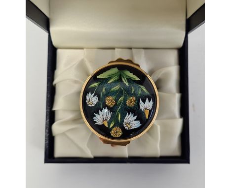 Moorcroft enamel trinket pot, cylindrical, powder green and black ground with sunflower decoration, initialled 'FW' to base, 