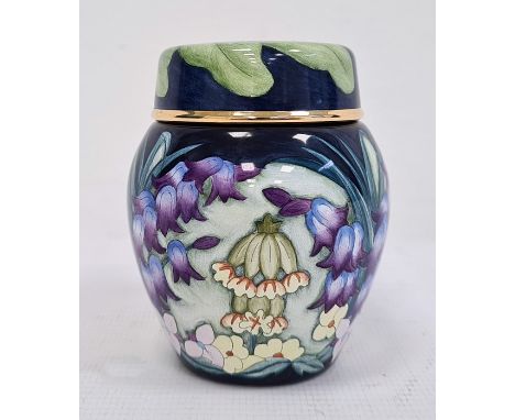 Moorcroft miniature enamel vase and cover, allover decoration of spring flowers including bluebells and cowslips, initialled 