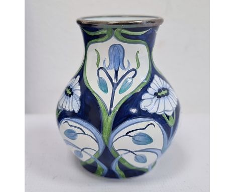 Moorcroft miniature enamel vase, baluster-shaped, blue ground with bluebell and daisy decoration in Art Nouveau style, initia