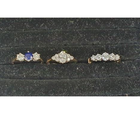 14ct gold, blue stone and cubic zirconia three-stone ring set central blue stone flanked by two cubic zirconia, 14ct gold and