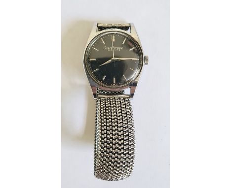 Gent's Girard Perregaux Gyromatic stainless steel wristwatch with black dial, baton numerals, side button and the expanding m