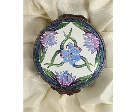 Moorcroft enamel trinket pot, cylindrical with blue cornflower and crocus decoration on a white ground, initialled 'RDR' to b