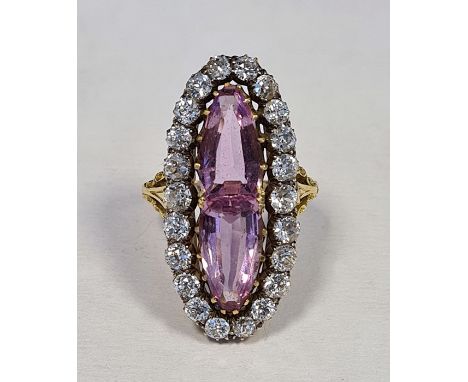 Gold-coloured pink stone, probably tourmaline, and diamond dress ring, of marquise form set with two pink facet-cut tourmalin