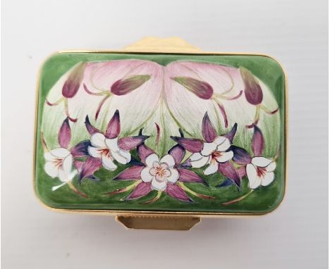 Moorcroft enamel patch box, rectangular, green ground and floral decorated, initialled 'FW' to base, 6cm wide