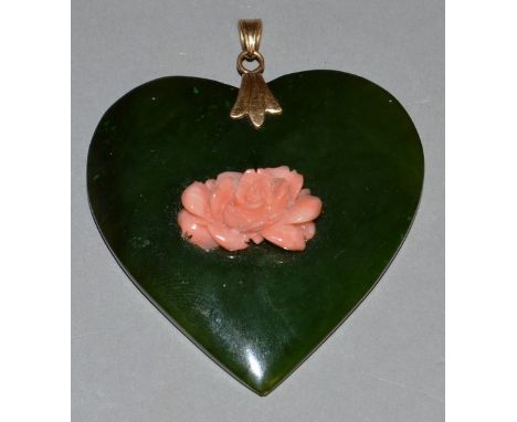 A SUPERB JADE HEART SHAPED PENDANT set with coral roses.