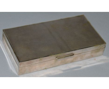 A LARGE .800 SILVER RECTANGULAR ENGINE TURNED CIGAR BOX with cedarwood liner.