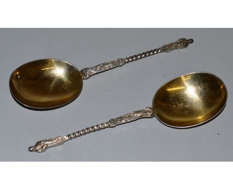 A GOOD PAIR OF APOSTLE SPOONS with silver gilt bowls. Sheffield 1912.