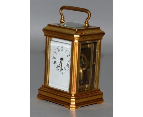 A GOOD BRASS MINIATURE CARRIAGE CLOCK. 3ins high.