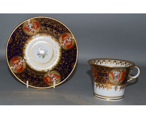 AN 18TH CENTURY WORCESTER RARE IMARI PATTERN TEACUP AND SAUCER with four fan shaped panels of fruit and flowers.