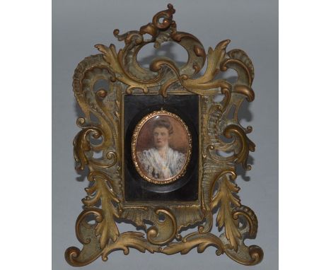 AN OVAL PORTRAIT MINIATURE OF GREAT GRANDMOTHER, Nee Dampier.  2ins x 1.5ins, in a metal easel frame.