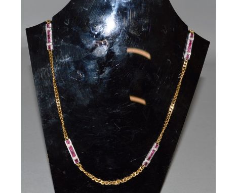 A GOOD GOLD NECKLACE set with four ruby and diamond sections in white gold.