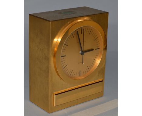 A SMALL TIFFANY & CO BRASS MANTLE CLOCK, quartz, engraved "In Recognition of 10 Years Service Estee Lauder".  5.25ins high.