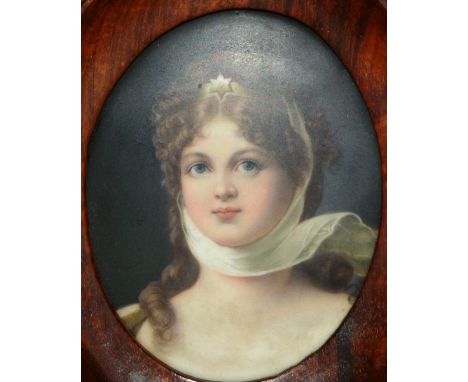 A 19TH CENTURY CONTINENTAL PORCELAIN OVAL PORTRAIT PLAQUE, head and shoulders of a pretty young girl.  3.25ins x 2.5ins, in a