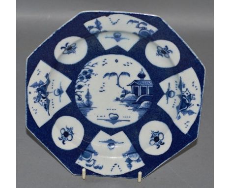 AN 18TH CENTURY BOW OCTAGONAL PLATE painted with circular and fan panels containing flowers or seascapes on a powder blue gro