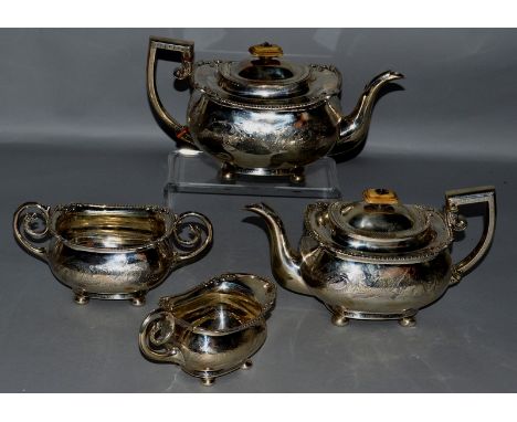 A GEORGE III FOUR PIECE TEA SET comprising two teapots, sugar basin and milk jug, with engraved decoration, the sugar basin a