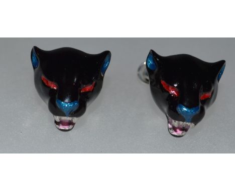 A PAIR OF HALLMARKED SILVER AND ENAMEL PANTHER HEAD CUFFLINKS.