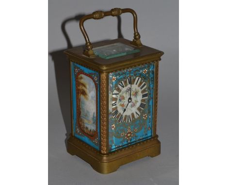 A MINIATURE BLUE ENAMEL AND BRASS CARRIAGE CLOCK painted with panels of flowers.  2.5ins high.