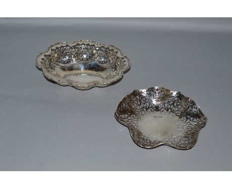 TWO PIERCED SILVER BONBON DISHES.Birmingham 1922 and Sheffield 1961.