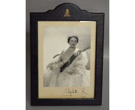 A SILVERED PHOTOGRAPH OF THE QUEEN MOTHER by CECIL BEATON.  Signed Elizabeth R 1976, in a leather easel photograph frame init